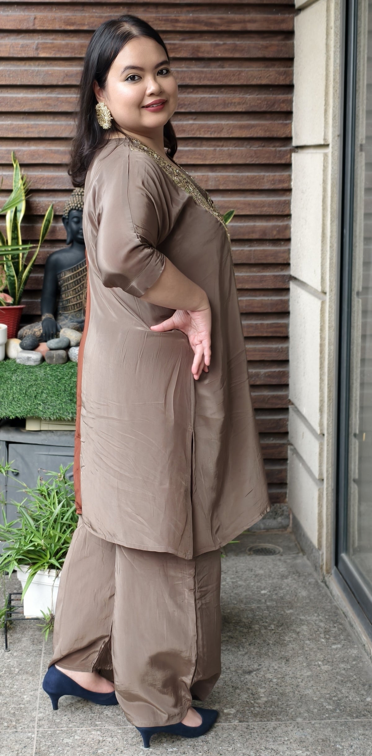 Side view showing the mocha half of the kurta and the deep side slit