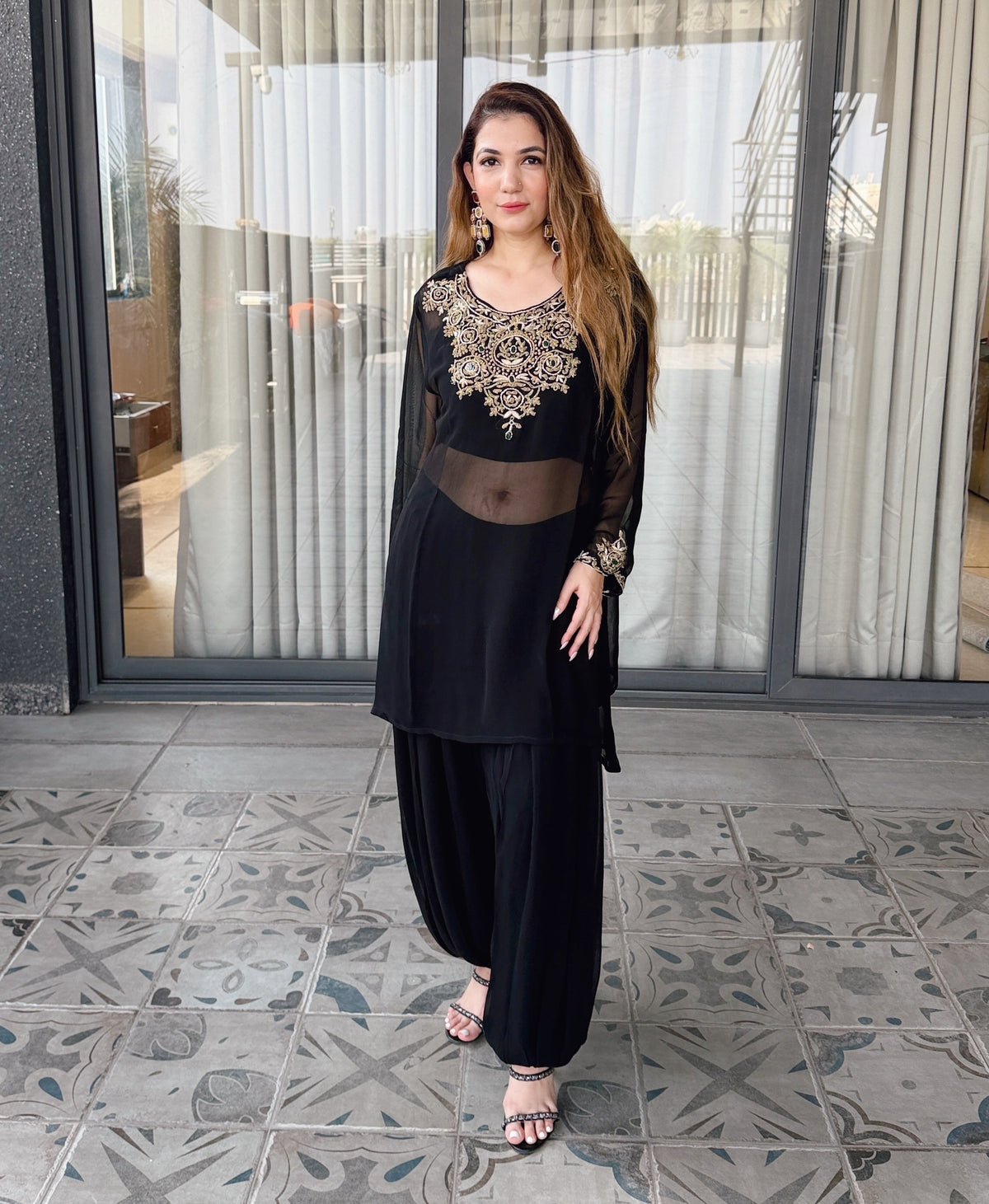 Syaahi Kundan Kaftan - full-length front view, black georgette kaftan with gold kundan yoke and dhoti pants