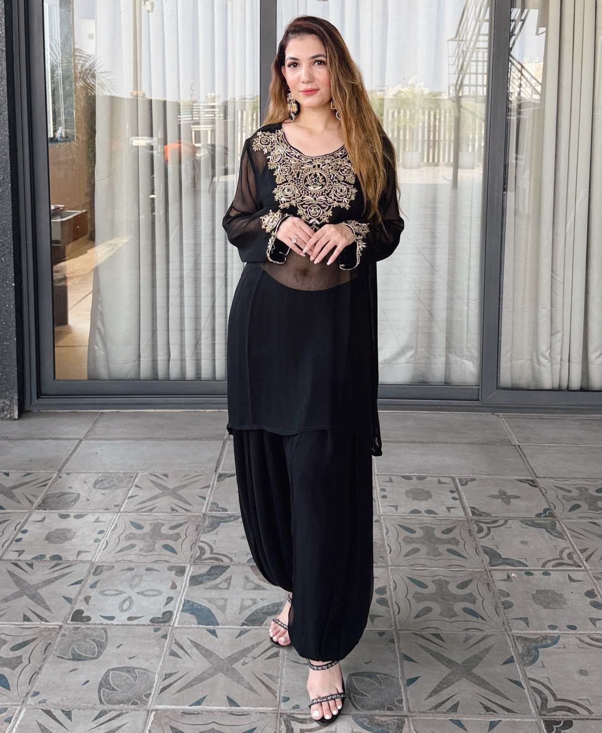 Syaahi Kundan Kaftan - full-length front view, hands at the embroidered cuffs